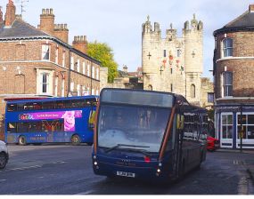 Electric buses wait to collect passengers on Blossom Street