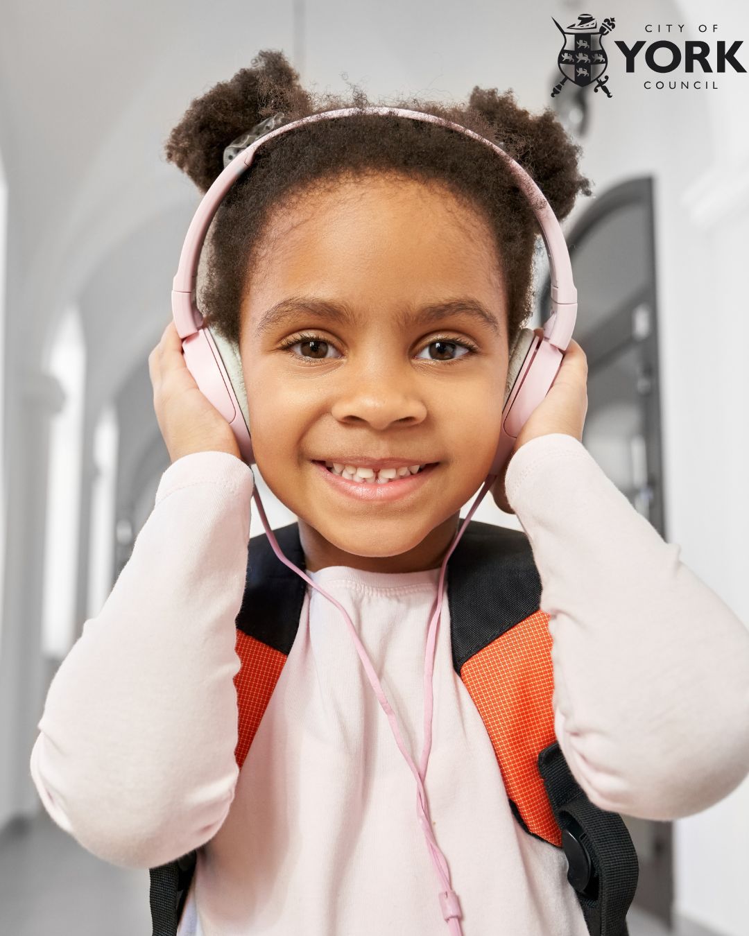 young girl wearing headphones