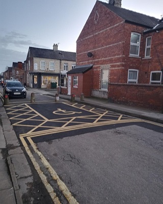 A view of the new accessible parking area, with freshly painted lines