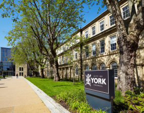 Front of west offices with council sign in foreground