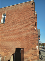 a blank brick wall, location of a potential mural