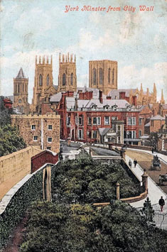 Old coloured postcard showing York Minster from the City Walls.