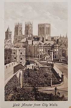 Old sepia postcard depicting York Minster from the City Walls.