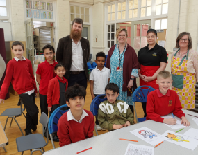 A group of children at Fishergate Primary School taking part in the new breakfast club, with Cllr Bob Webb and members of staff from Fishergate Primary.