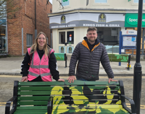 A photo of AOP representatives with the newly painted benches on Front Street.